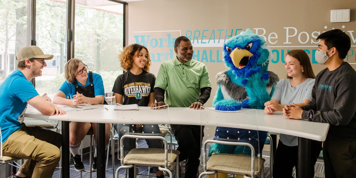 AACC students talking to Swoop.